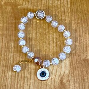 Elegant Gold and White Beaded Bracelet with Eye Charm